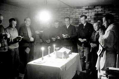 German POWs celebrating midnight mass together.