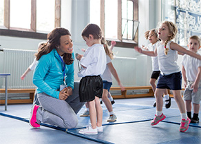 A CPE Health instructor works with children