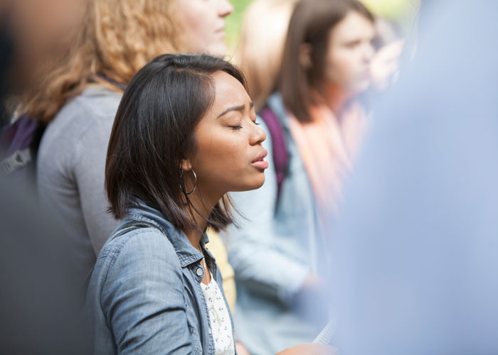 student worshipping