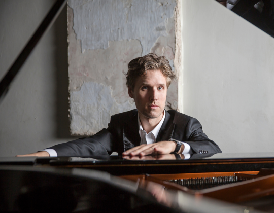 Pianist Gabrielius Alekna at the piano.